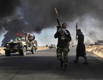 Армия Каддафи выбила повстанцев сразу из двух городов