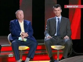 Жириновский на теледебатах НТВ подарил Прохорову часы Breguet