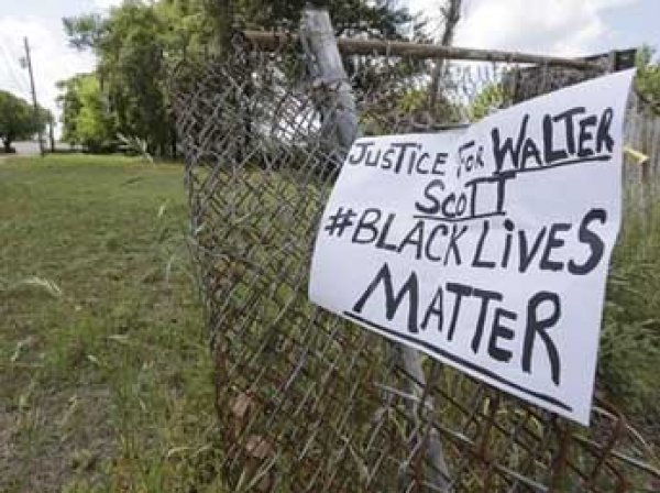 В США родне убитого белым полицейским чернокожего заплатят ,5 млн