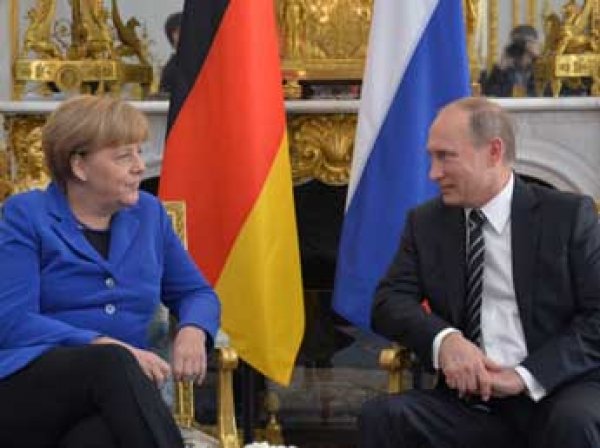 ИноСМИ назвали Меркель и Путина самым влиятельными людьми года