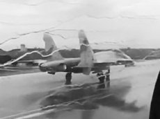Взлет истребителей Су-27 сквозь ливень